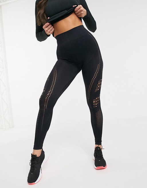 PrettyLittleThing gym leggings with cut out detail in black