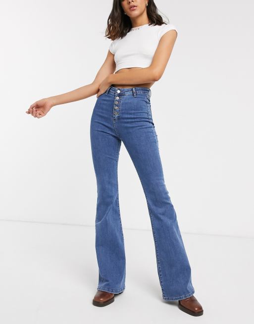 PrettyLittleThing high waisted stretch flare jean in mid wash