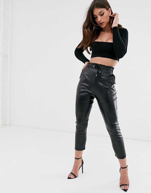 PrettyLittleThing leather look joggers with tie waist in black