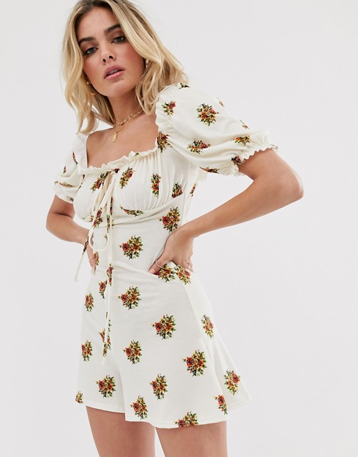 PrettyLittleThing milkmaid playsuit with puff sleeve in cream floral