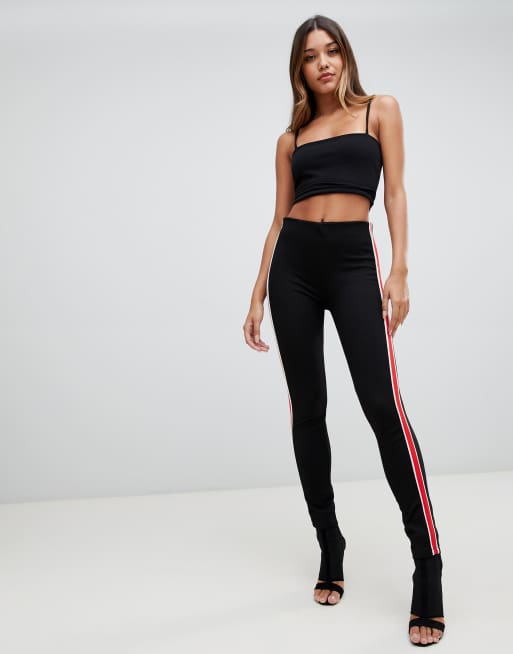 Black leggings with red shop stripe down the side