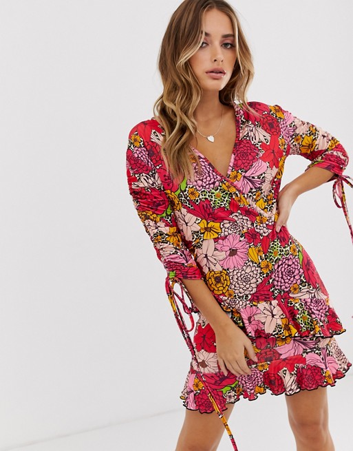 PrettyLittleThing wrap mini dress with ruched sleeve in pink floral
