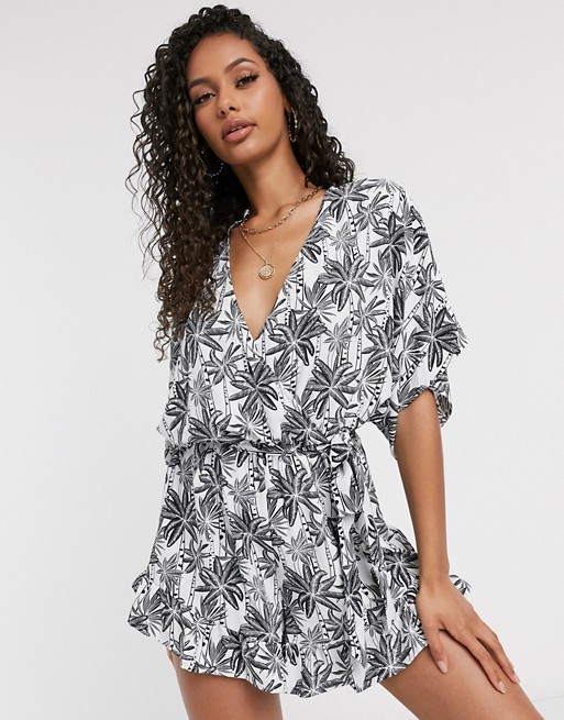 PrettyLittleThing wrap playsuit in black and white palm print
