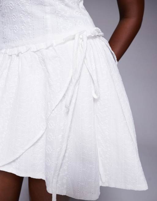 Princess Polly Cosie eyelet sleeveless tie side ruffle hem mini dress in  white