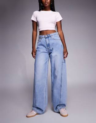 Princess Polly - Esperance - Barrel-Leg-Jeans in blauer Vintage-Waschung mit Ziernähten