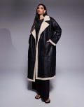 [Princess Polly] Princess Polly leather look contrast faux shearling button front longline coat in black and beige L/XL BLACK