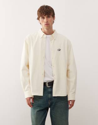 Prohibited Prohibited long sleeve oversized button down logo shirt in cream-Neutral