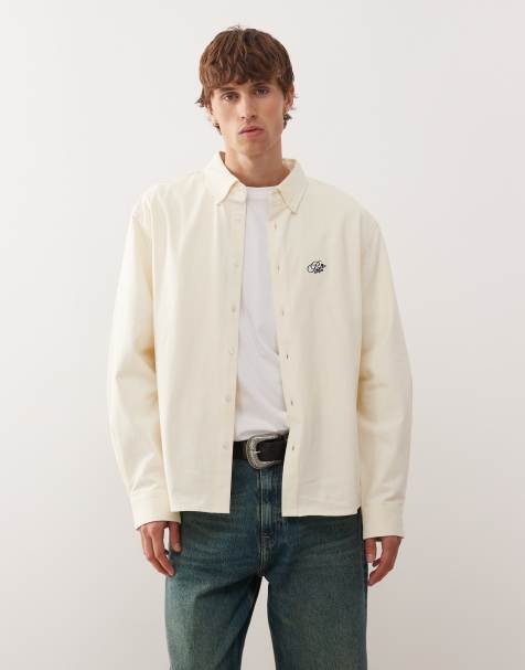 Prohibited long sleeve oversized button down logo shirt in cream - view 1