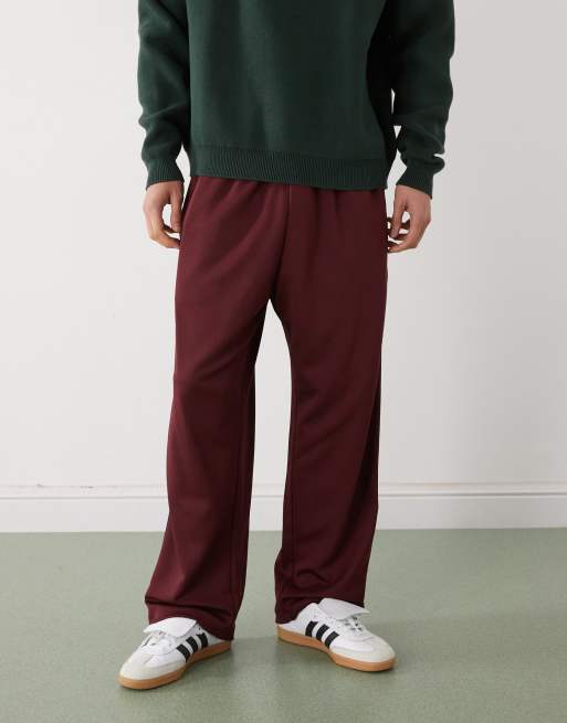 Prohibited loose fit drawstring sweatpants with constrast stripes in burgundy