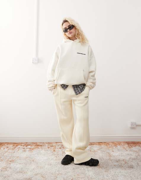 Prohibited script logo straight leg trackies in cream - view 1