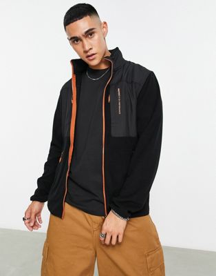 Vanern full zip top in black and orange