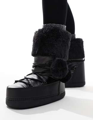 Aster snowboots with fur trim and pom pom detail in Black