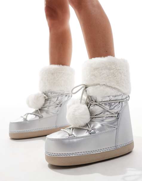 Public Desire Aster snowboots with with faux fur trim and pom pom detail in silver - view 1