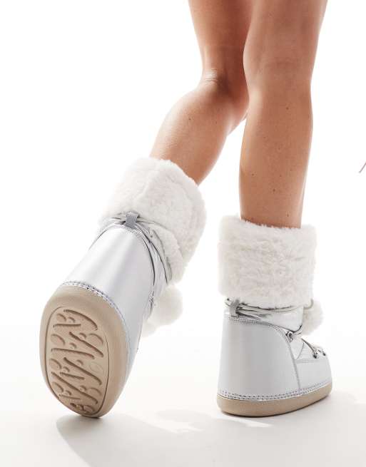 Public Desire Aster snowboots with with fur trim and pom pom detail in silver