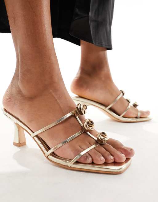 Public Desire Cassidy mid heeled mules with rosettes in gold