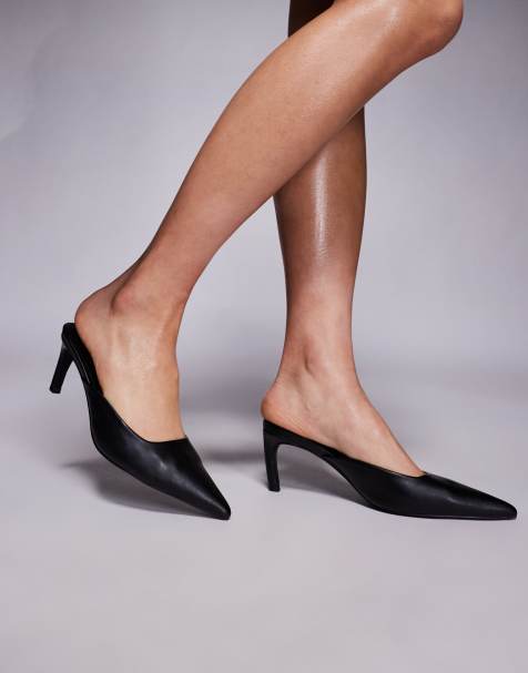 Public Desire Edgar curved heel pointed mules in black - view 1