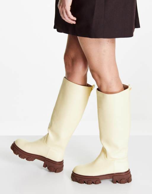 Public Desire Elena knee high chunky sole boots in butter ASOS