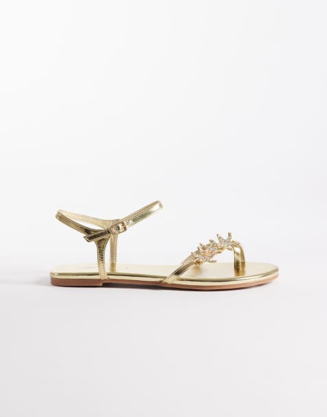 Public Desire – Elina – Guldfärgade, platta sandaler med smala remmar och snäckor - view 1