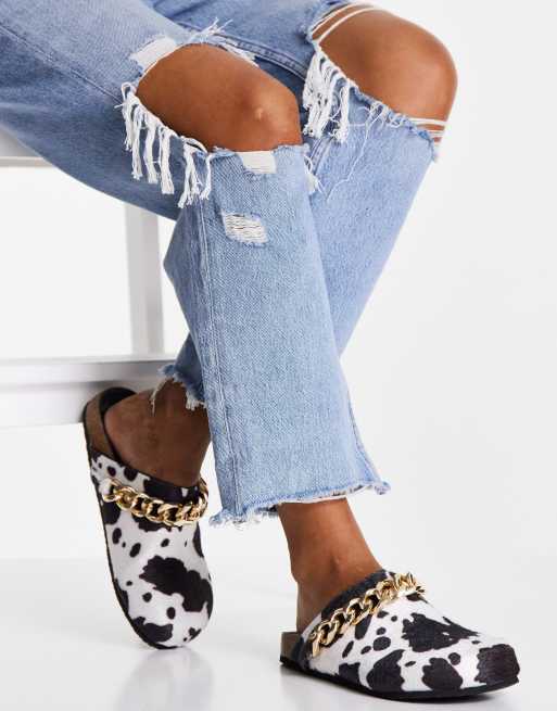 Public Desire Isabel mule clogs with chain trim in cow print