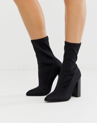 Public Desire Libby high heeled sock boots in black | ASOS