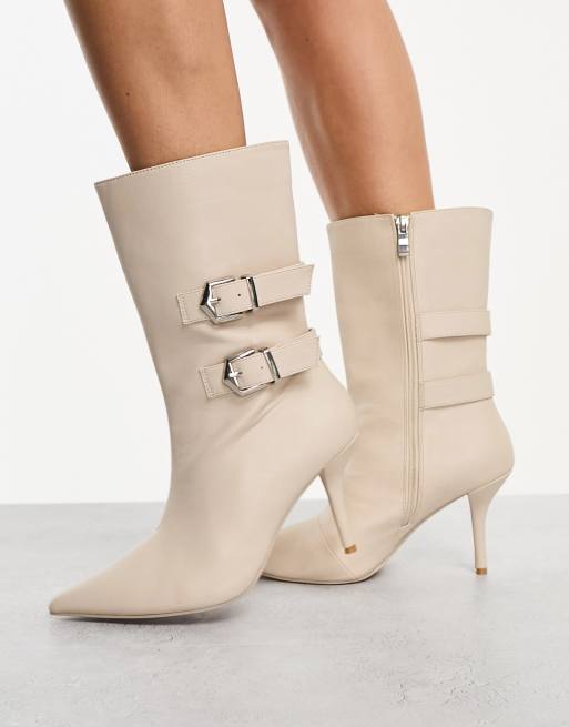 High heel store boots with buckles