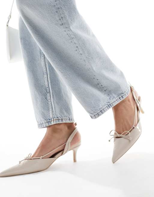 Public Desire Rai pointed heeled bei shoes with bow detail in cream patent