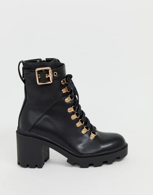 black boots with gold hardware