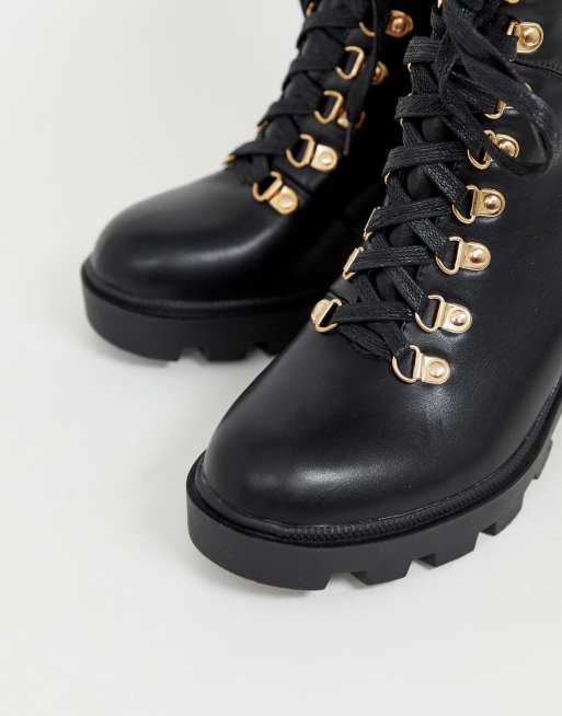 black boots with gold hardware