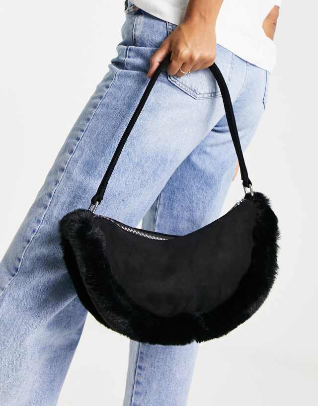 Public Desire The Kinley half moon bag in black with faux fur trim