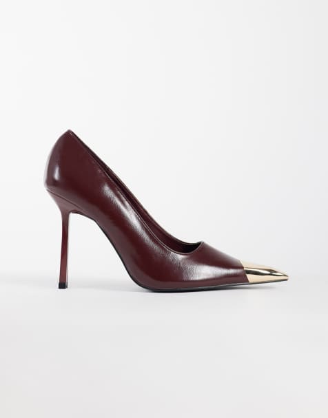 Public Desire Wide Fit Rotate heeled court shoes in burgundy patent with gold detail - view 1