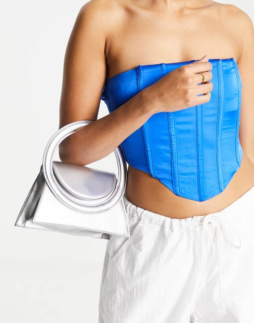 Public Desire x Paris Artiste - The Dagon - Clutch-taske i metallisk sølvfarve - Kun hos ASOS