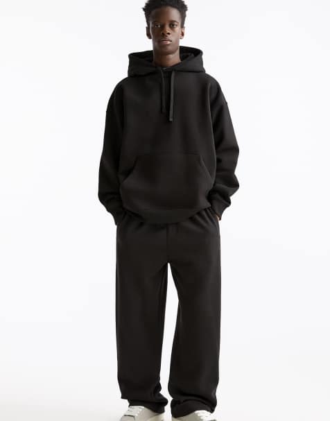 Pull&Bear Baggy tracksuit bottoms in black - view 1