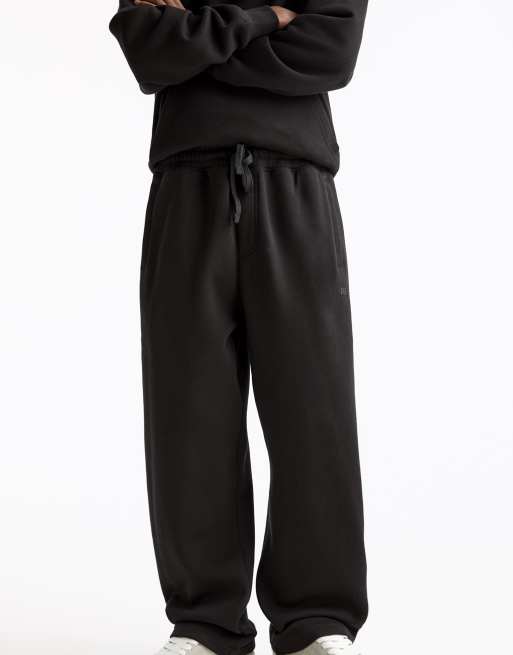Pull&Bear Baggy tracksuit bottoms in black