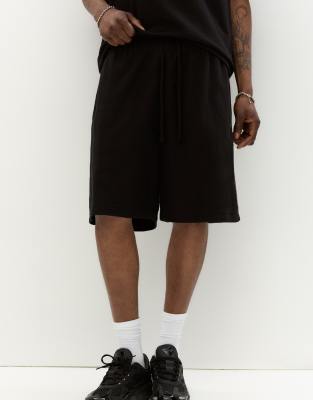 Pull & Bear - Bermuda de jogging texturé coupé en diagonale - Noir