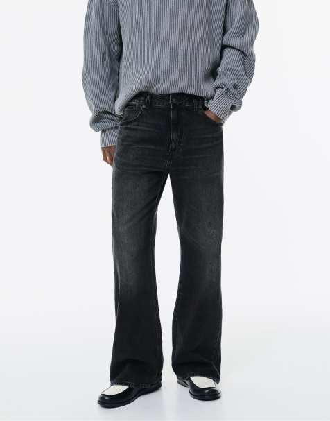 Pull&Bear – Bleksvarta jeans med klockformade ben - view 1