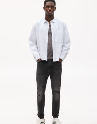 Pull&Bear – Bleksvarta jeans med morotsben och revor - view 1