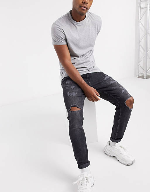 assembly Head boom Pull&Bear carrot fit jeans with rips in black | ASOS