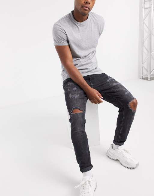 Pull&Bear carrot fit jeans with rips in black