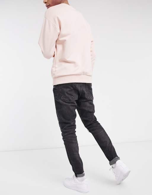 Ripped carrot fit jeans on sale