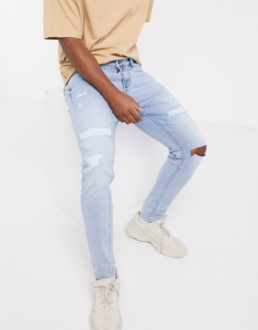 Pull&Bear carrot fit jeans with rips in light blue