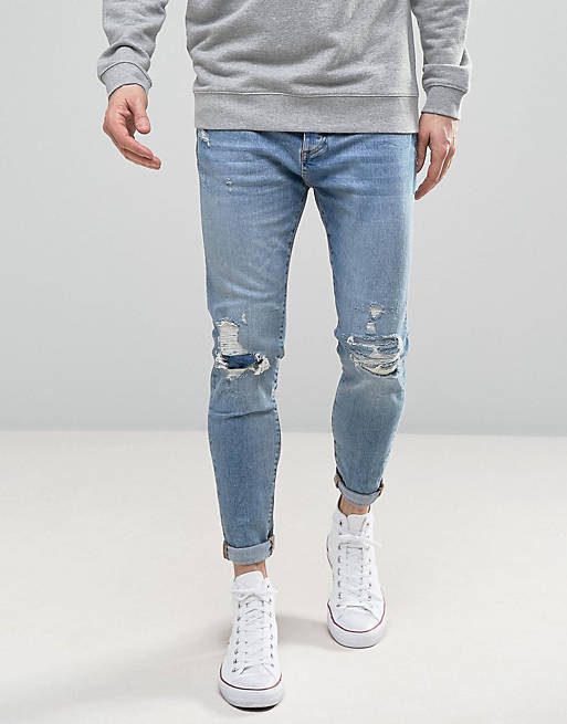 Pull&Bear Carrot Fit Jeans With Rips In Light Wash | ASOS