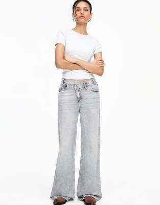 crossover waist mid rise wide leg jeans in gray