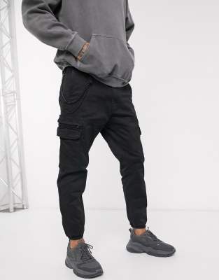 cuffed black cargo trousers