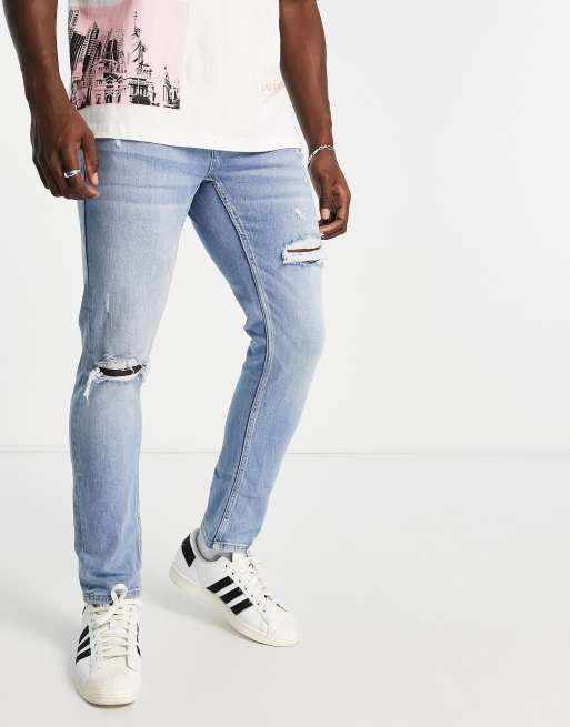 Pull&Bear – Dopasowane niebieskie jeansy z przetarciami