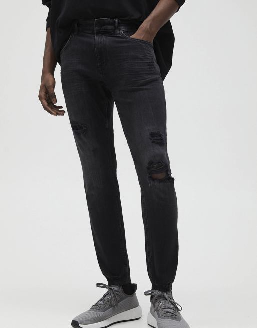 Pull&Bear – Eng geschnittene Premium-Jeans in Schwarz mit Zierrissen