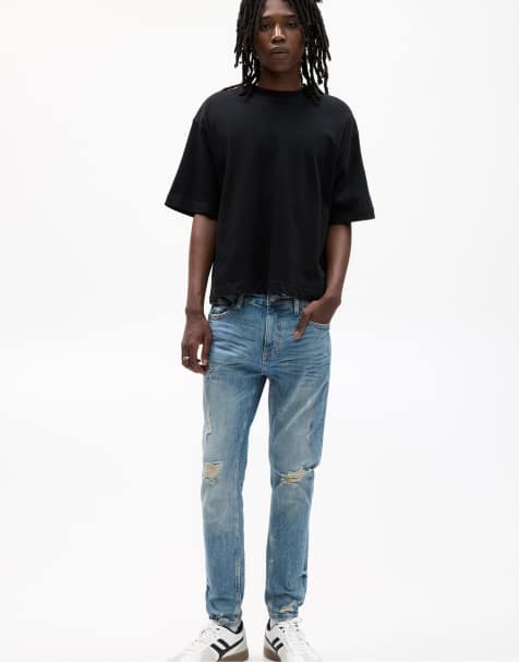 Pull&Bear – Enge Jeans in Mittelblau mit Zierrissen - view 1