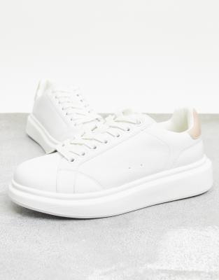 nude and white trainers