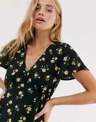 yellow dress with black flowers
