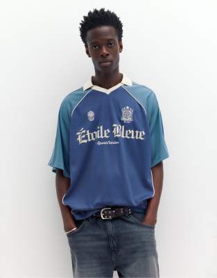 Fußball-Polohemd in kräftigem Blau mit „STWD"-Grafikprint Blau L
