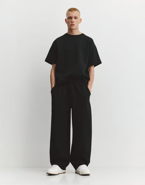 Pull&Bear Interlock balloon tracksuit bottoms in black